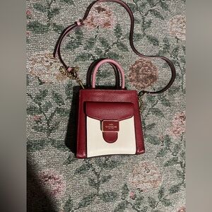 Mini Pepper Coach crossbody with red, white, and cream ♥️